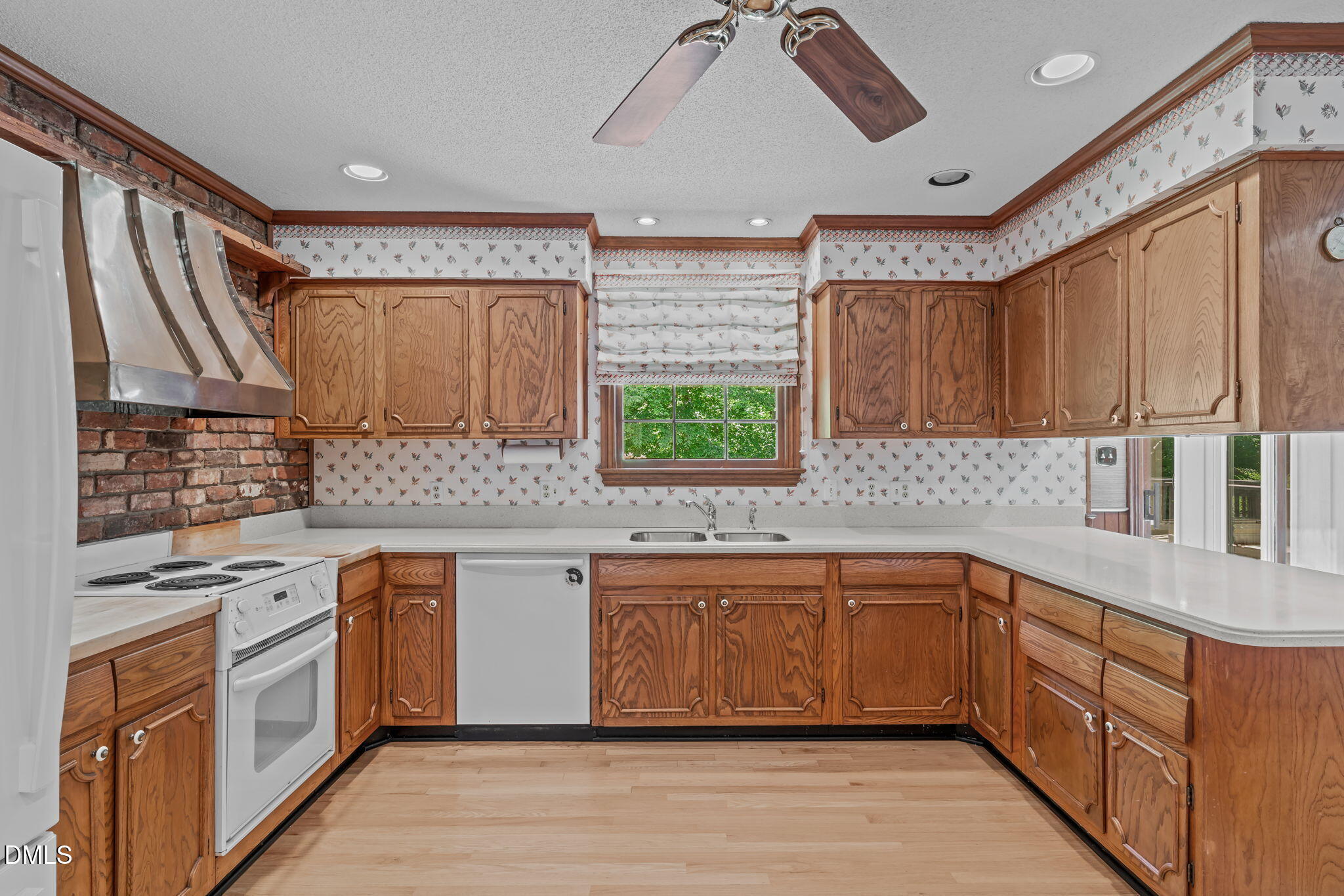 1205 Kimberly Drive Raleigh, NC 27609 - Photo 17 of 45 a kitchen with stainless steel appliances granite countertop a sink and cabinets