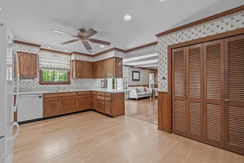 a kitchen with stainless steel appliances granite countertop a sink and cabinets