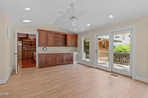 a kitchen with stainless steel appliances kitchen island granite countertop a refrigerator and a stove top oven