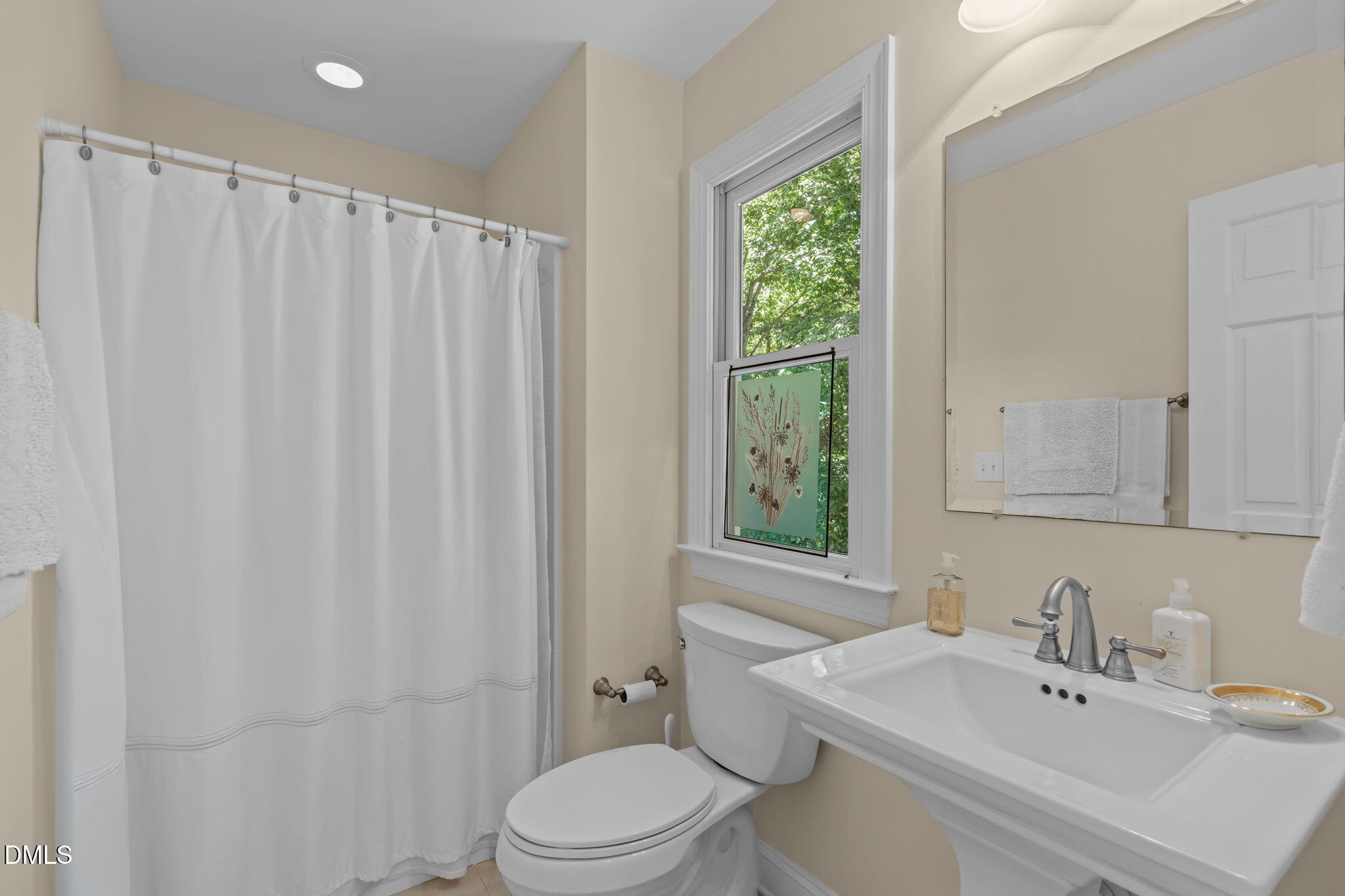 1205 Kimberly Drive Raleigh, NC 27609 - Photo 20 of 45 a bathroom with a sink toilet and shower