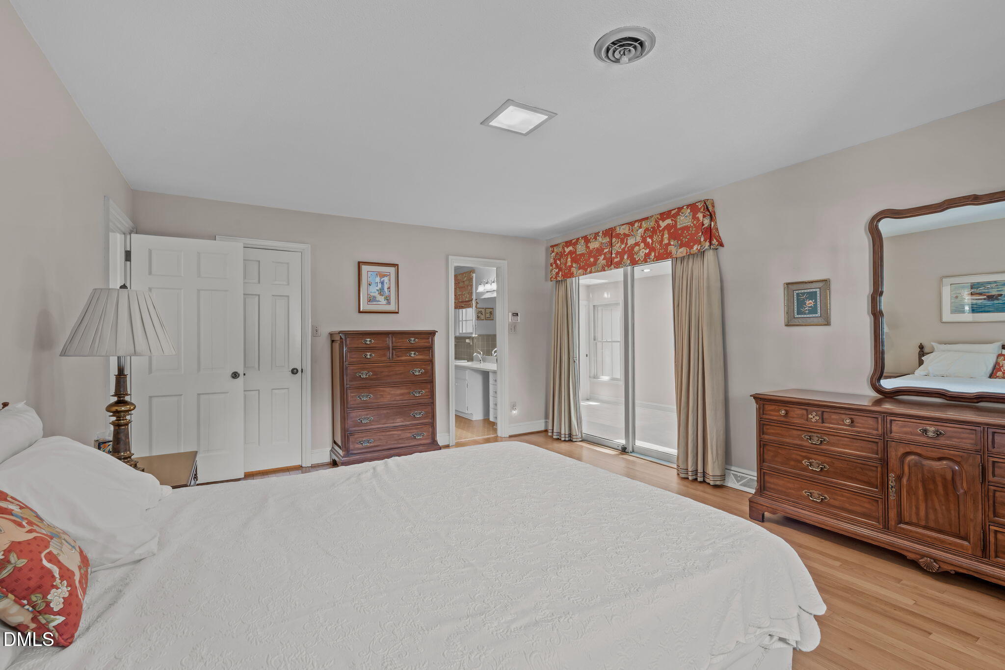 1205 Kimberly Drive Raleigh, NC 27609 - Photo 23 of 45 a bedroom with a bed and a dresser