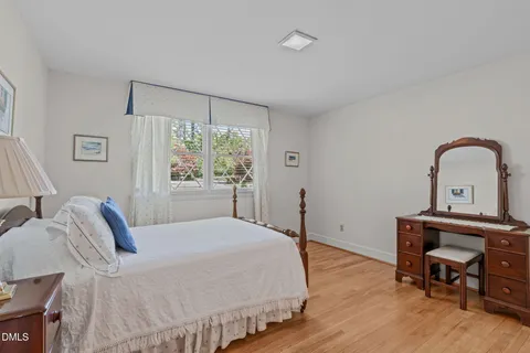 a view of a room with wooden floor and closet