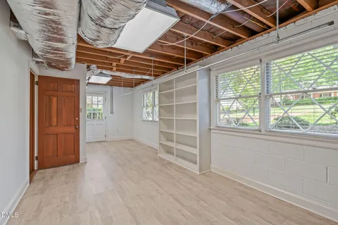 a view of storage and utility room with a window