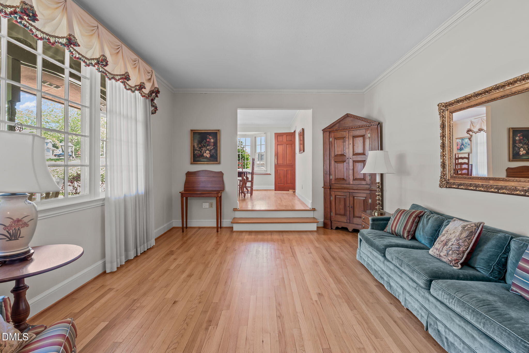 1205 Kimberly Drive Raleigh, NC 27609 - Photo 4 of 45 a living room with furniture and a wooden floor