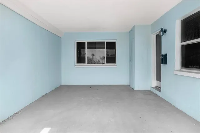 an empty room with windows