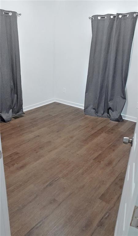 5844 Old Bill Cook Road Atlanta, GA 30349 - Photo 16 of 32 a view of a room with wooden floor and a window