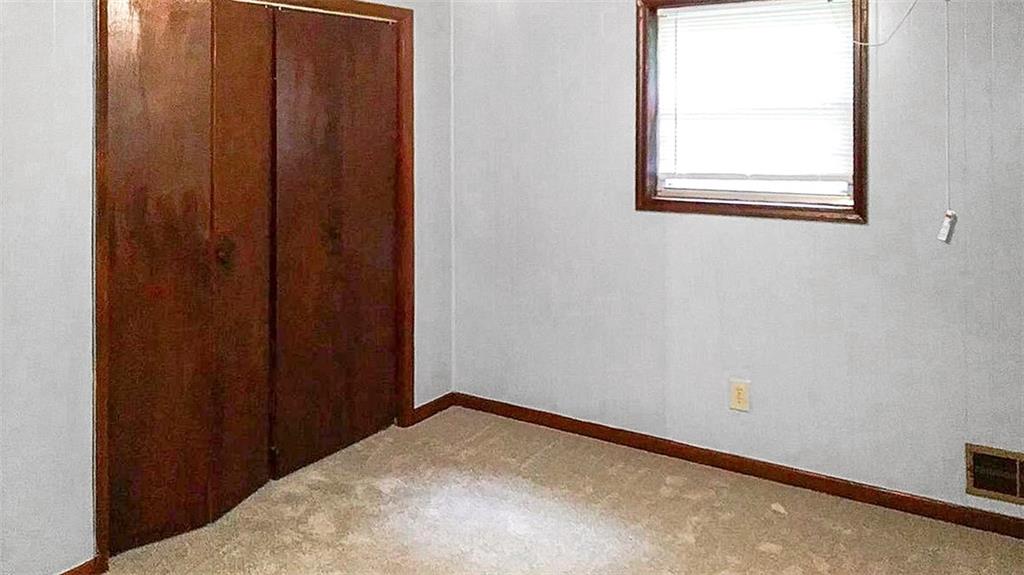 5844 Old Bill Cook Road Atlanta, GA 30349 - Photo 4 of 32 a view of a small space with wooden floor and a window