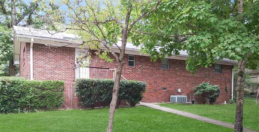 5844 Old Bill Cook Road Atlanta, GA 30349 - Photo 6 of 32 a view of house with a yard