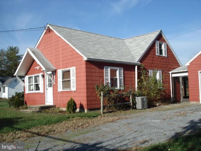 a view of house with yard