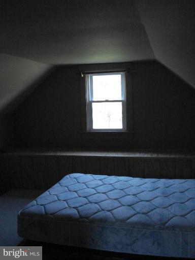 26152 Hobbs Road Denton, MD 21629 - Photo 13 of 16 a bed sitting in a bedroom next to a window