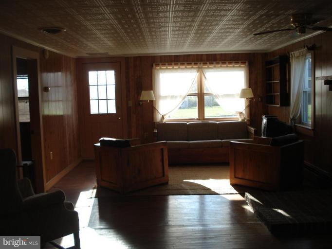 26152 Hobbs Road Denton, MD 21629 - Photo 6 of 16 a living room with furniture window and wooden floor