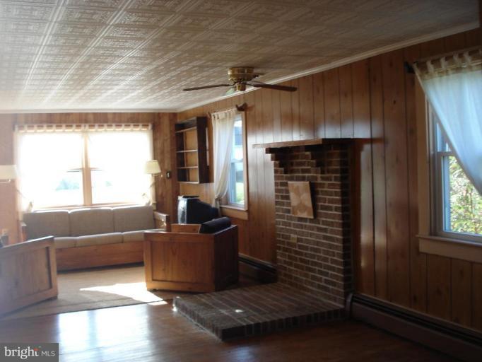 26152 Hobbs Road Denton, MD 21629 - Photo 7 of 16 a living room with furniture and a window
