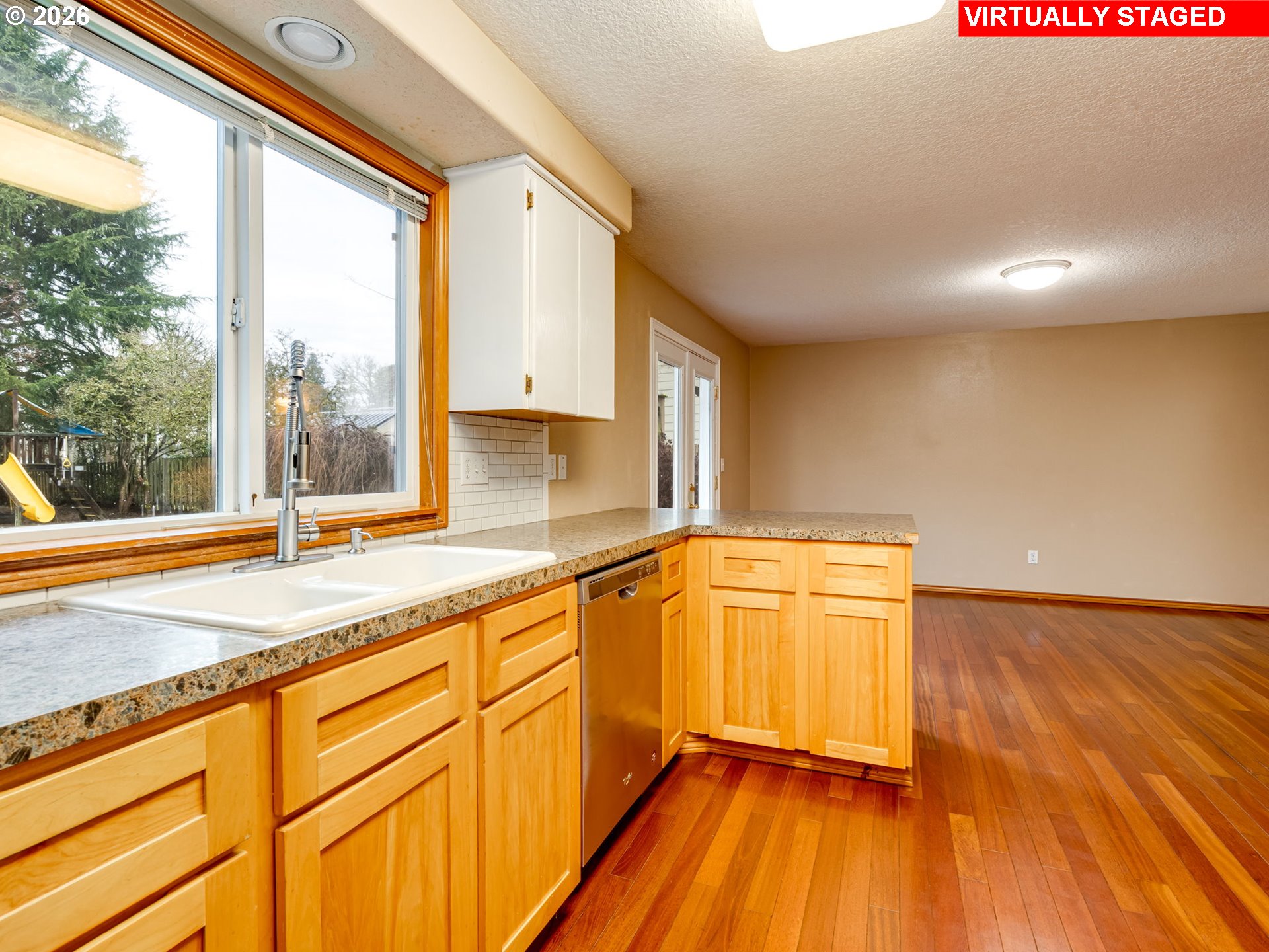 1250 South Cedar Loop Canby, OR 97013 - Photo 19 of 42 a view of a kitchen with wooden floor and a sink