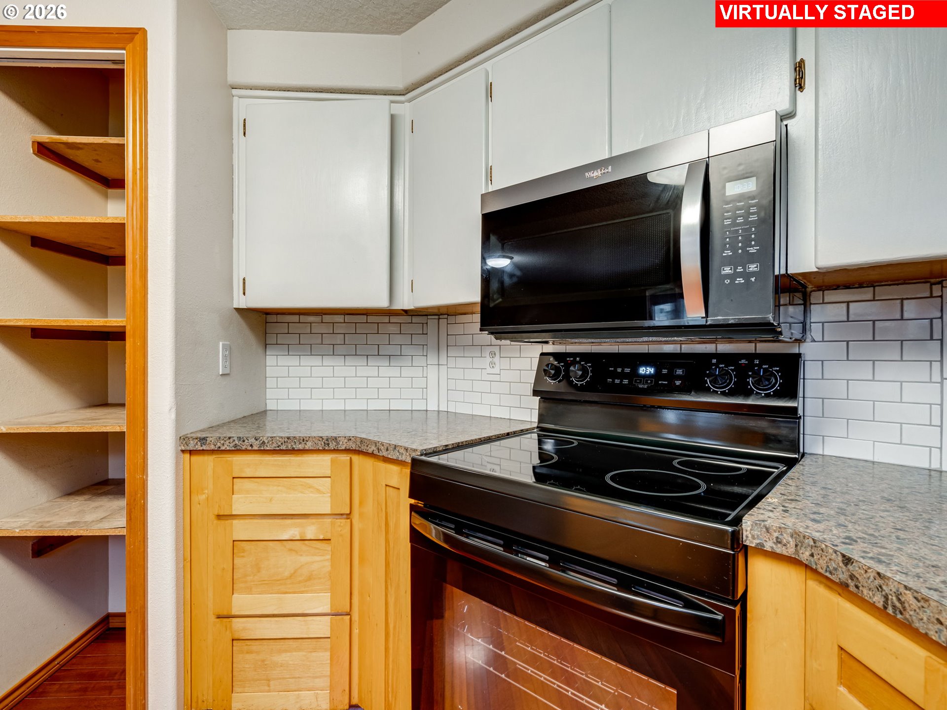 1250 South Cedar Loop Canby, OR 97013 - Photo 20 of 42 a kitchen with a stove and a microwave