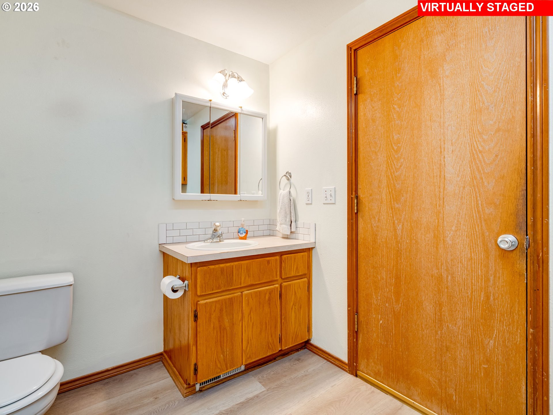 1250 South Cedar Loop Canby, OR 97013 - Photo 23 of 42 a bathroom with a sink a toilet and mirror