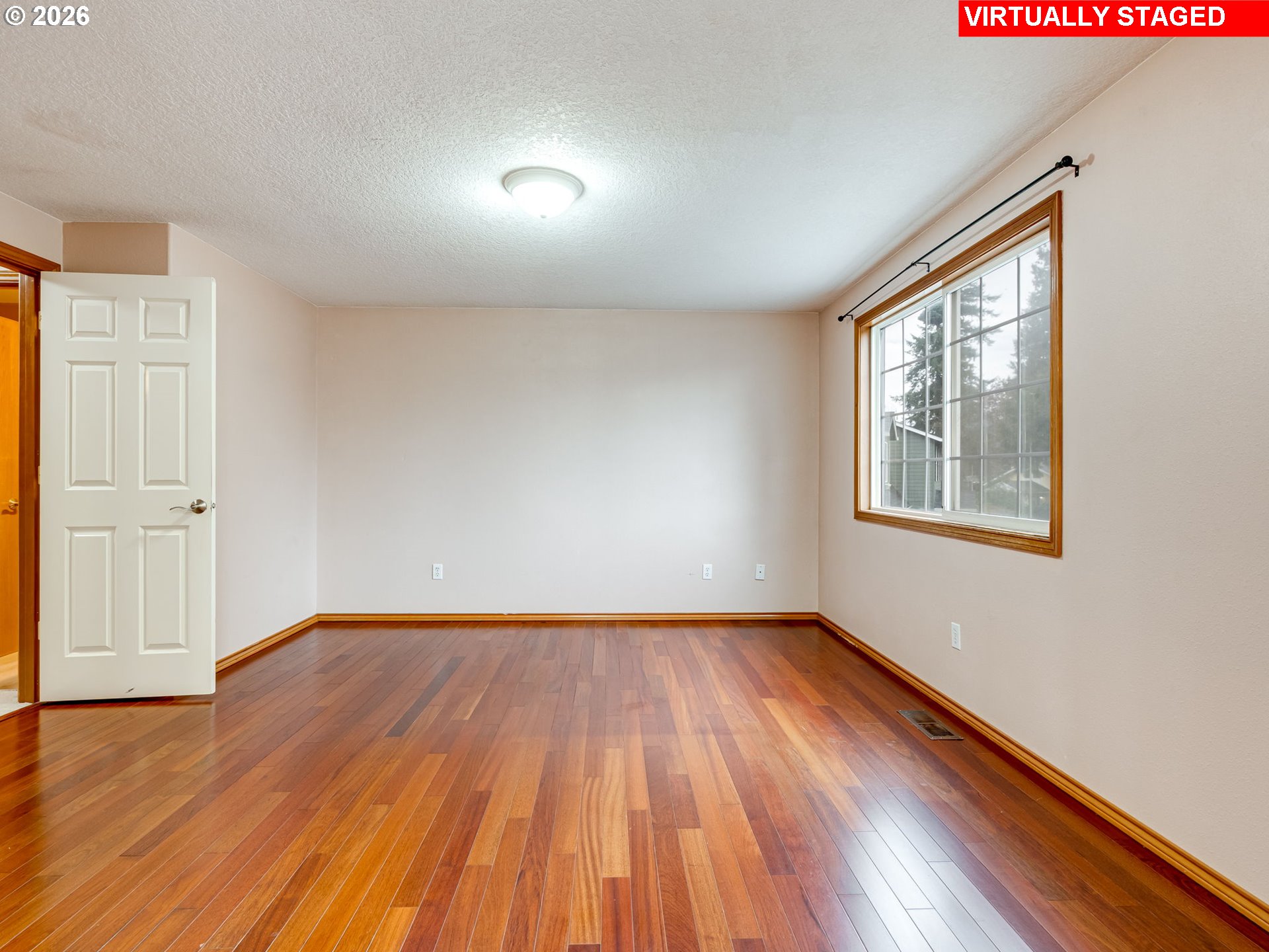 1250 South Cedar Loop Canby, OR 97013 - Photo 25 of 42 an empty room with wooden floor and windows