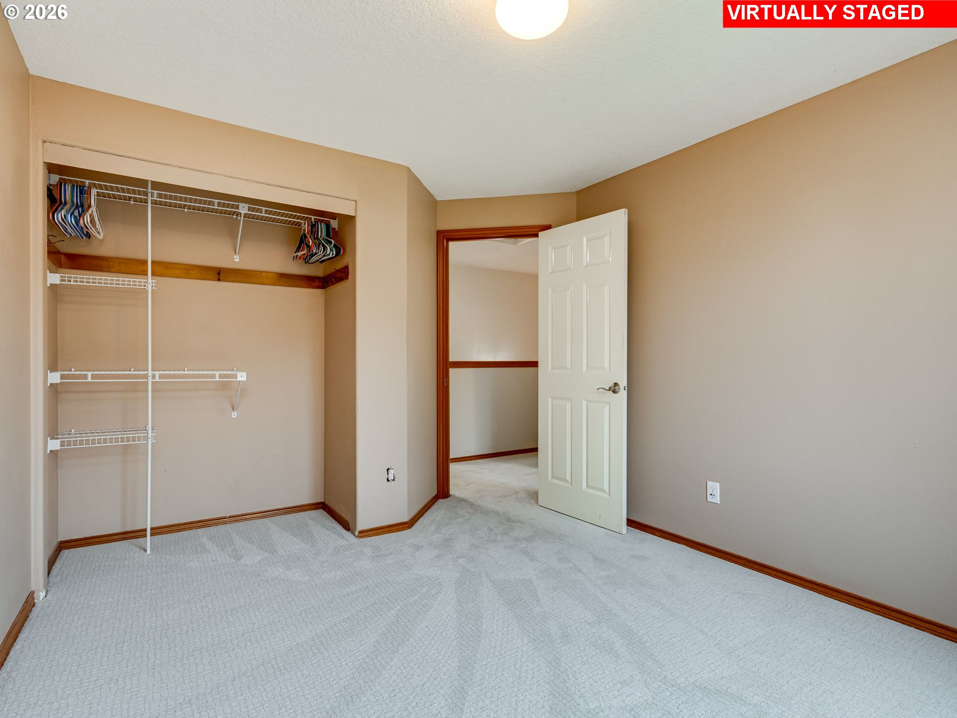 1250 South Cedar Loop Canby, OR 97013 - Photo 34 of 42 an empty room with closet and wooden door