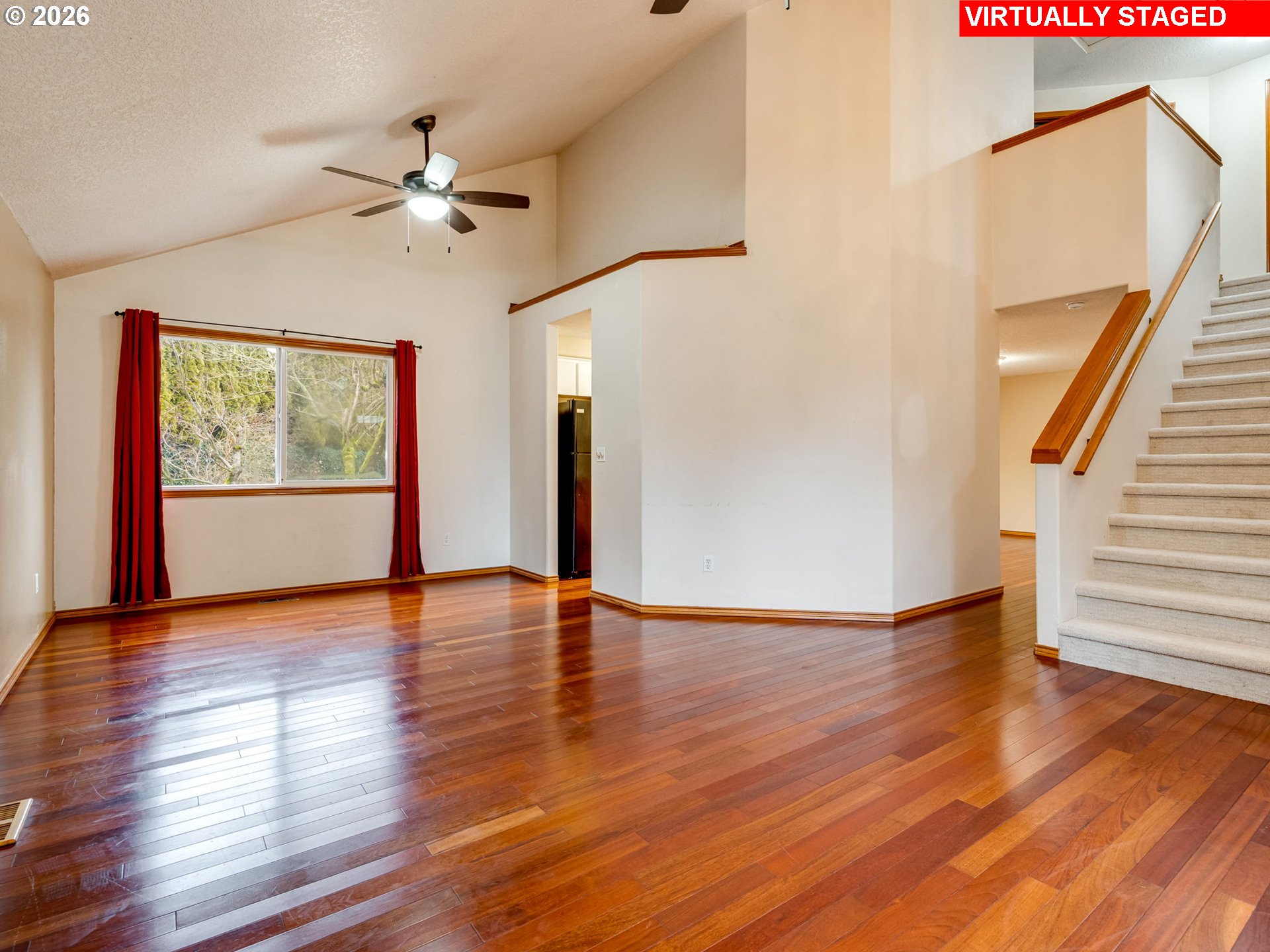 1250 South Cedar Loop Canby, OR 97013 - Photo 5 of 42 a view of an empty room with wooden floor and fan