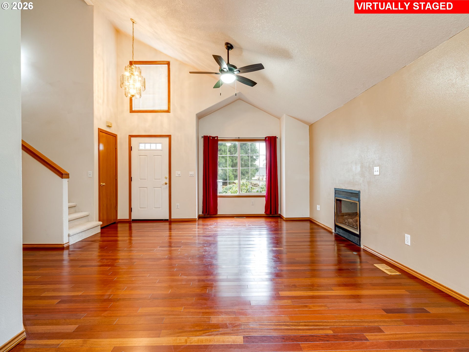 1250 South Cedar Loop Canby, OR 97013 - Photo 9 of 42 a view of an empty room with window and wooden floor