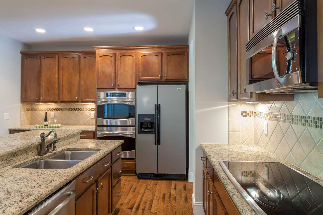 8915 Scotch Castle Drive Raleigh, NC 27612 - Photo 8 of 25 The kitchen provides ample counter space. The island set up is perfect for entertaining. Kitchen