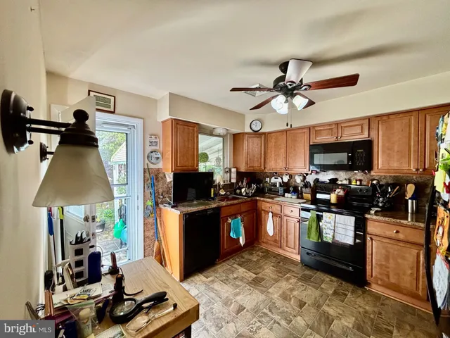 a kitchen with a sink appliances and cabinets