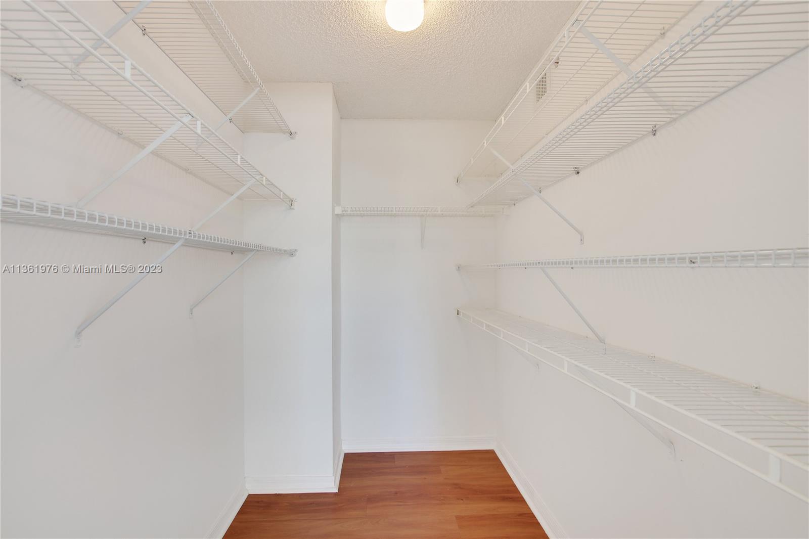 1111 Brickell Bay Drive, Unit 1102 Miami, FL 33131 - Photo 30 of 72 a view of small space with racks on the wall