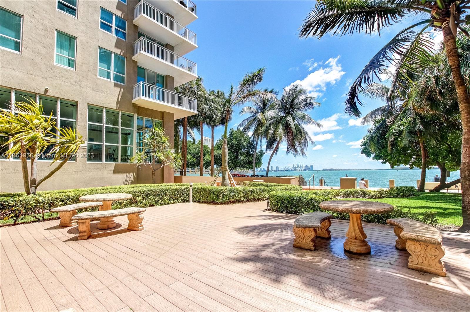 1111 Brickell Bay Drive, Unit 1102 Miami, FL 33131 - Photo 50 of 72 a view of a park with potted plants and palm trees
