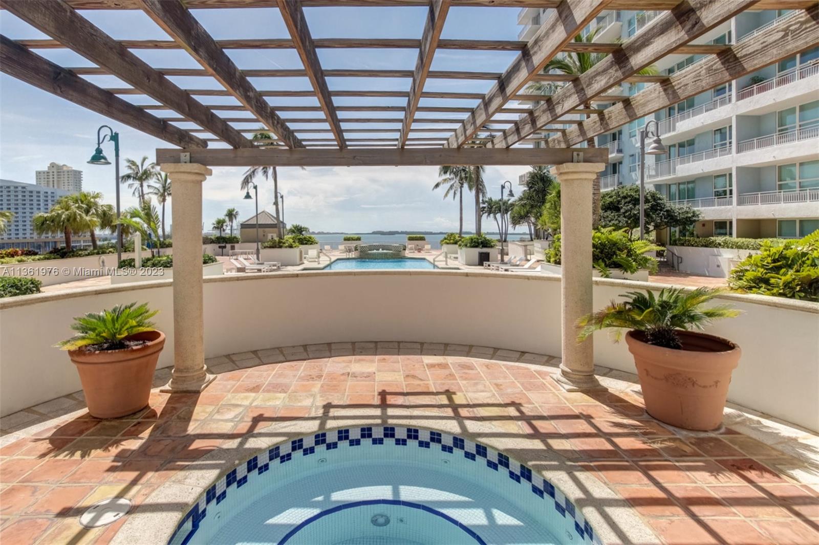 1111 Brickell Bay Drive, Unit 1102 Miami, FL 33131 - Photo 56 of 72 a view of a porch with a potted plant