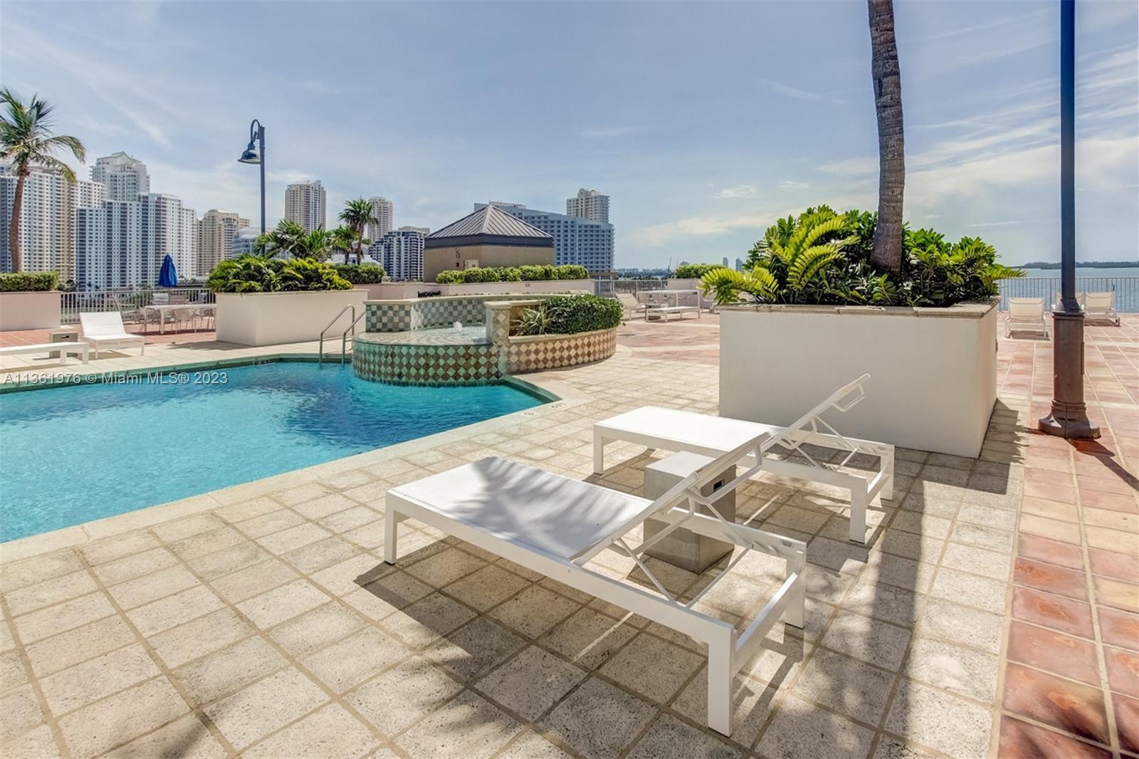 1111 Brickell Bay Drive, Unit 1102 Miami, FL 33131 - Photo 61 of 72 a view of a house with a yard