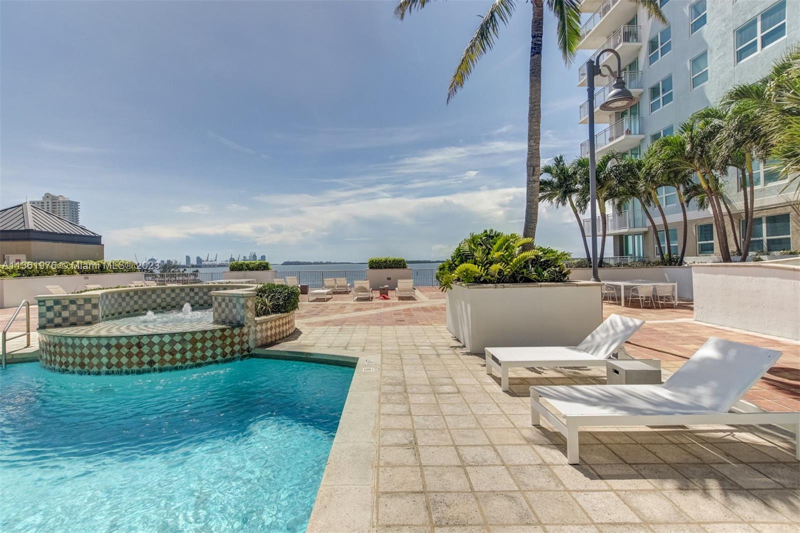1111 Brickell Bay Drive, Unit 1102 Miami, FL 33131 - Photo 62 of 72 a view of a house with backyard and sitting area