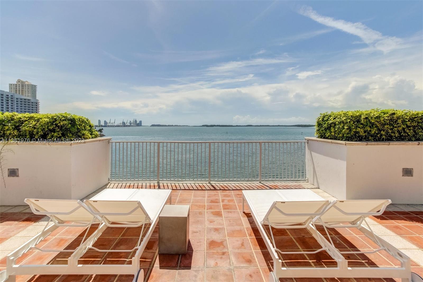 1111 Brickell Bay Drive, Unit 1102 Miami, FL 33131 - Photo 63 of 72 a view of balcony with wooden floor and seating space