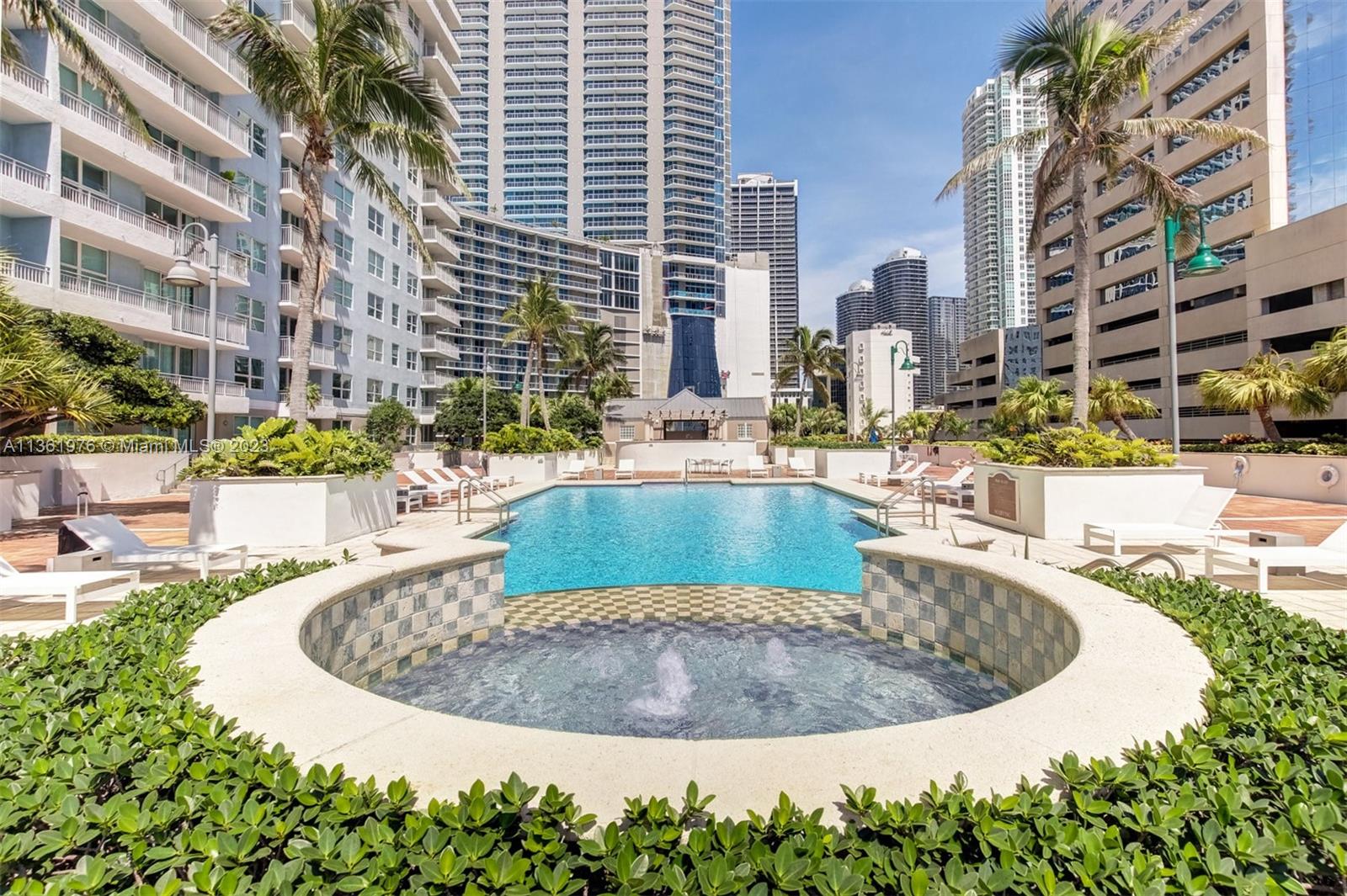 1111 Brickell Bay Drive, Unit 1102 Miami, FL 33131 - Photo 66 of 72 a view of a swimming pool with a balcony