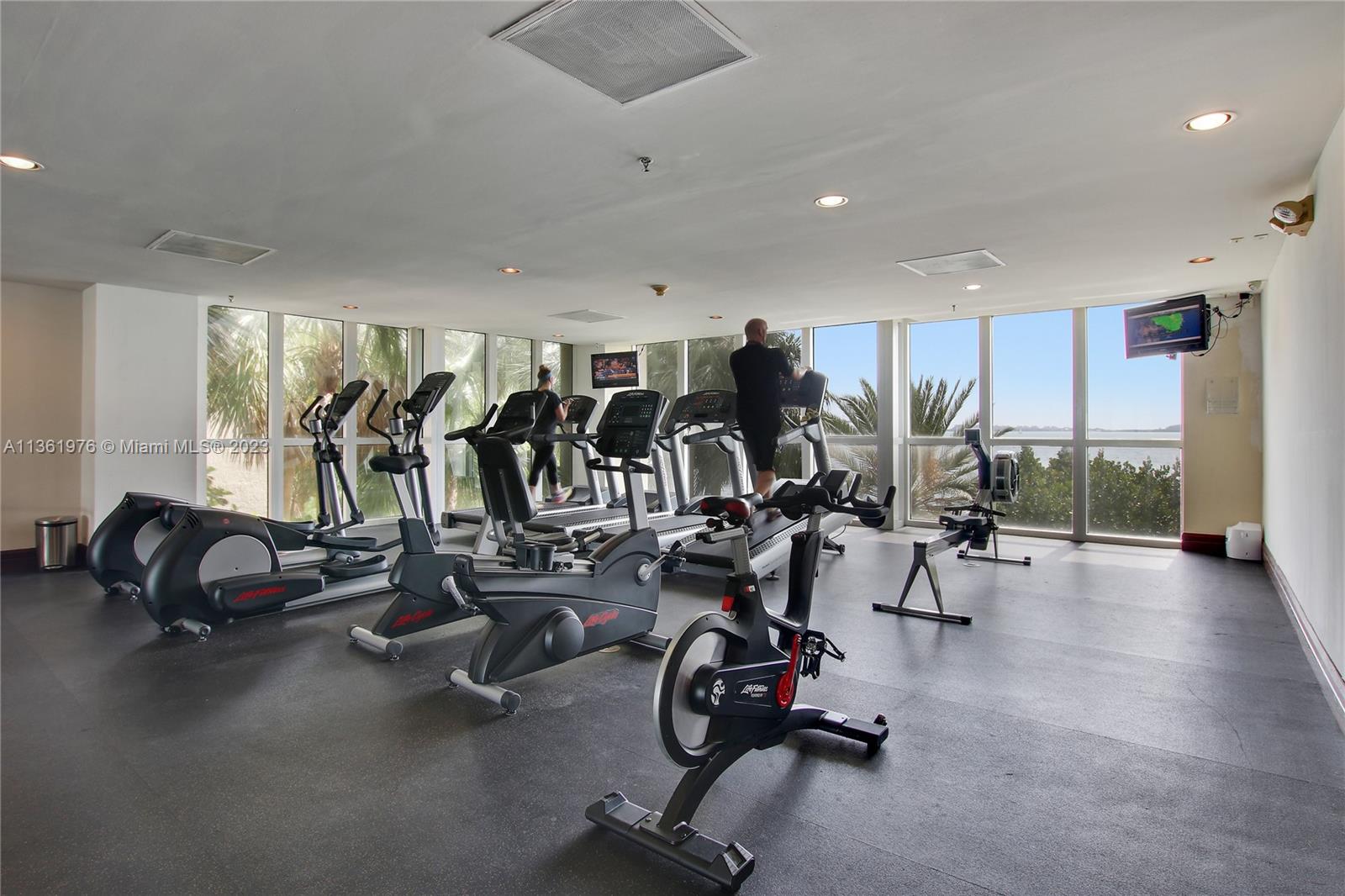 1111 Brickell Bay Drive, Unit 1102 Miami, FL 33131 - Photo 68 of 72 a view of a room with gym equipment