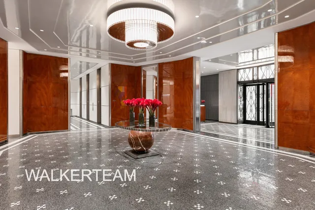 a view of building with glass windows and door