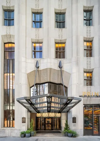 a view of building with glass windows and door