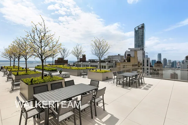 a view of outdoor space with seating area and barbeque oven