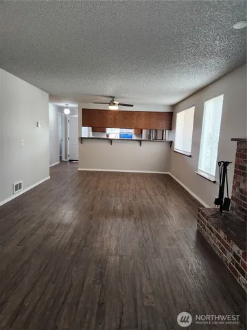 a view of a livingroom with wooden floor
