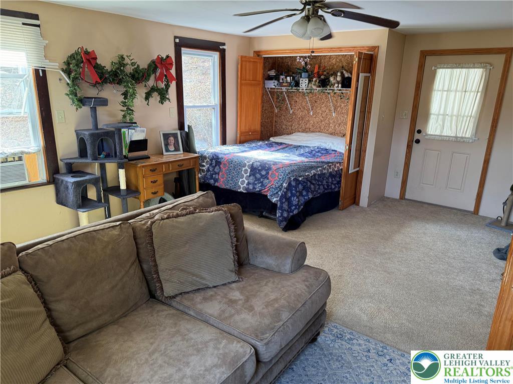 1227 Valley Road Tamaqua, PA 18252 - Photo 13 of 47 a bedroom with bed and a chandelier