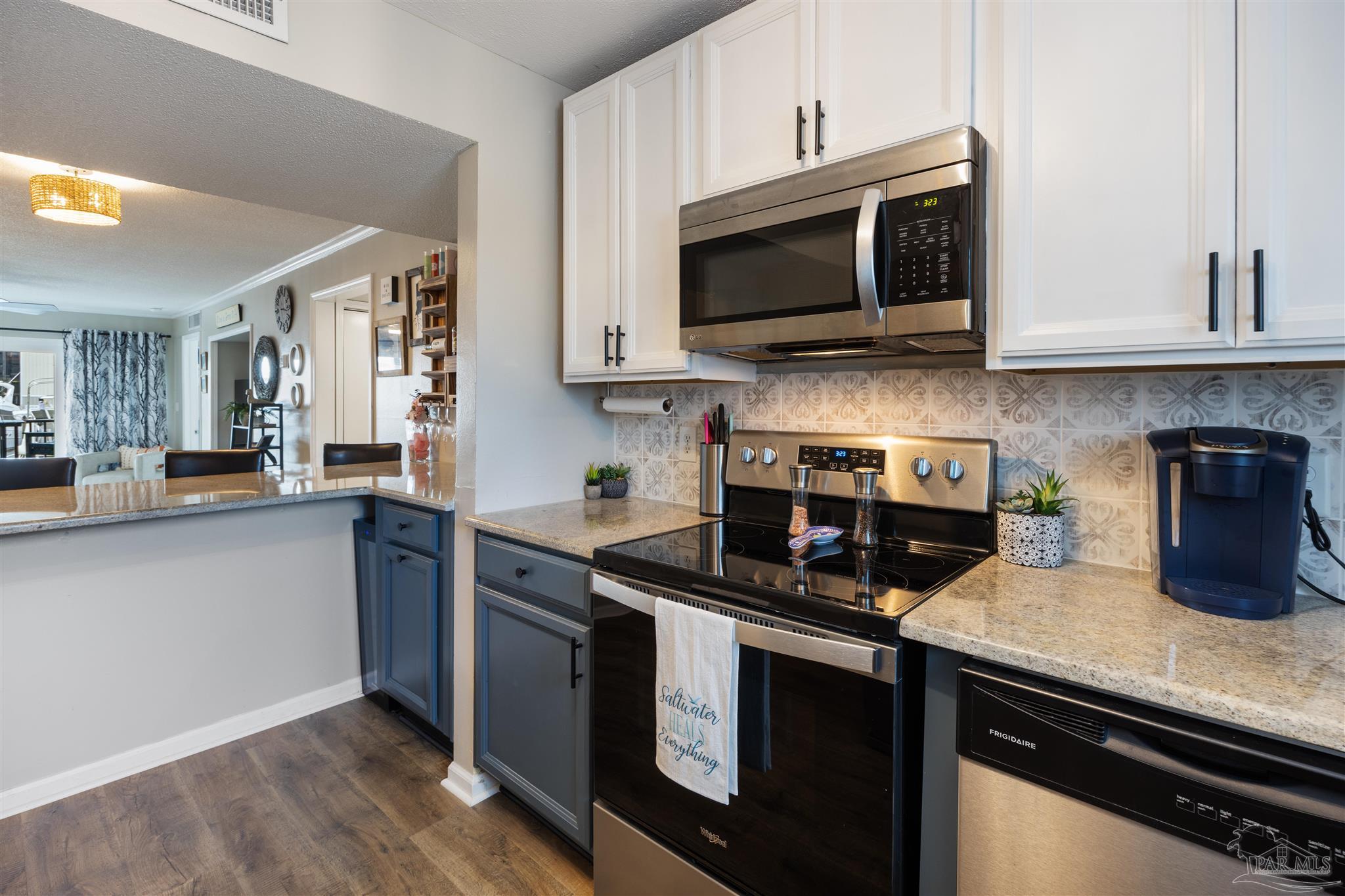 14100 River Road, Unit 122B Perdido Key, FL 32507 - Photo 5 of 46 a kitchen with a sink and steel appliances