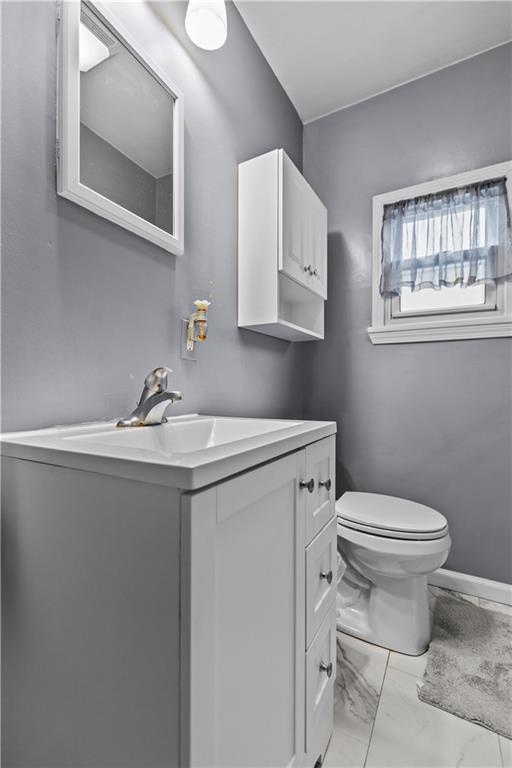 10204 Pearl Road Pittsburgh, PA 15235 - Photo 15 of 32 a bathroom with a sink toilet and mirror