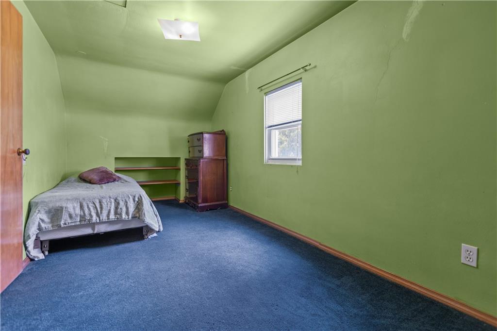 10204 Pearl Road Pittsburgh, PA 15235 - Photo 19 of 32 a bedroom with a bed and a window