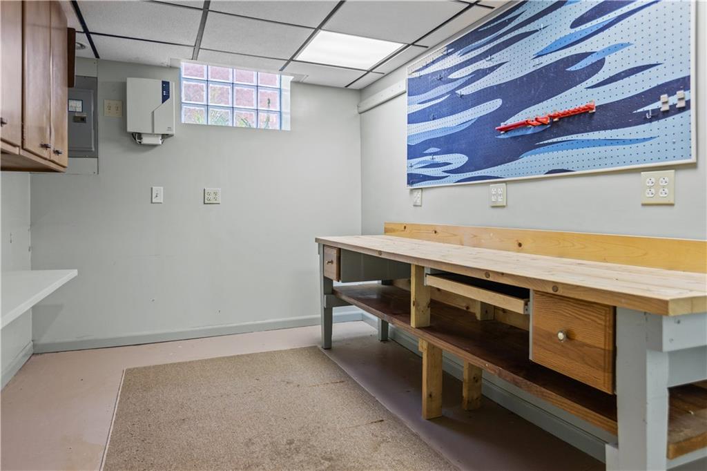 10204 Pearl Road Pittsburgh, PA 15235 - Photo 22 of 32 a kitchen with stainless steel appliances cabinets and a table