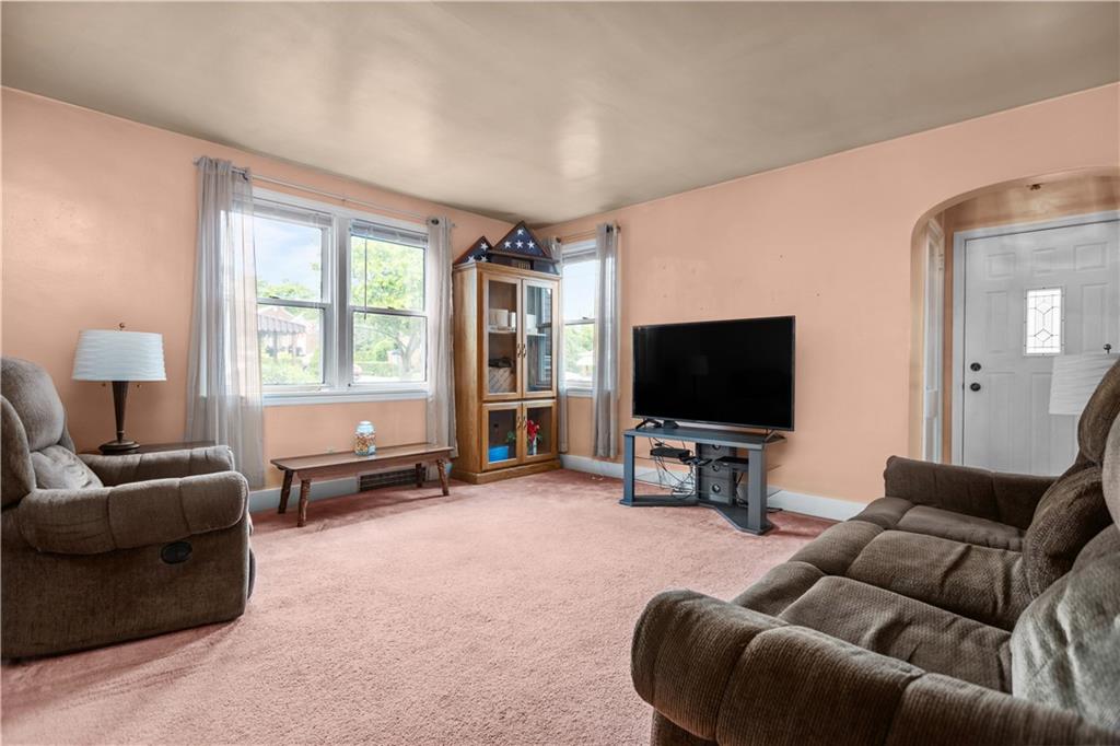 10204 Pearl Road Pittsburgh, PA 15235 - Photo 3 of 32 a living room with furniture and a flat screen tv