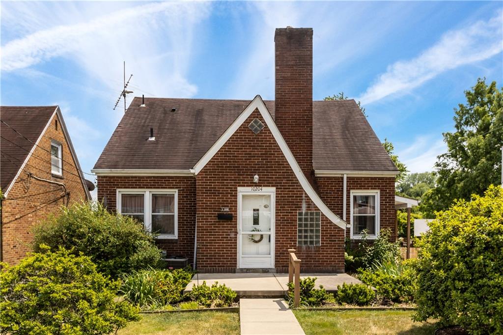 10204 Pearl Road Pittsburgh, PA 15235 - Photo 31 of 32 front view of a house with a yard