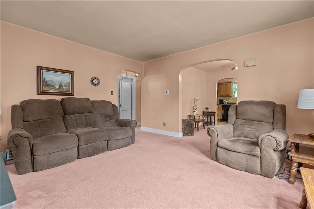 10204 Pearl Road Pittsburgh, PA 15235 - Photo 4 of 32 a living room with furniture and a large window