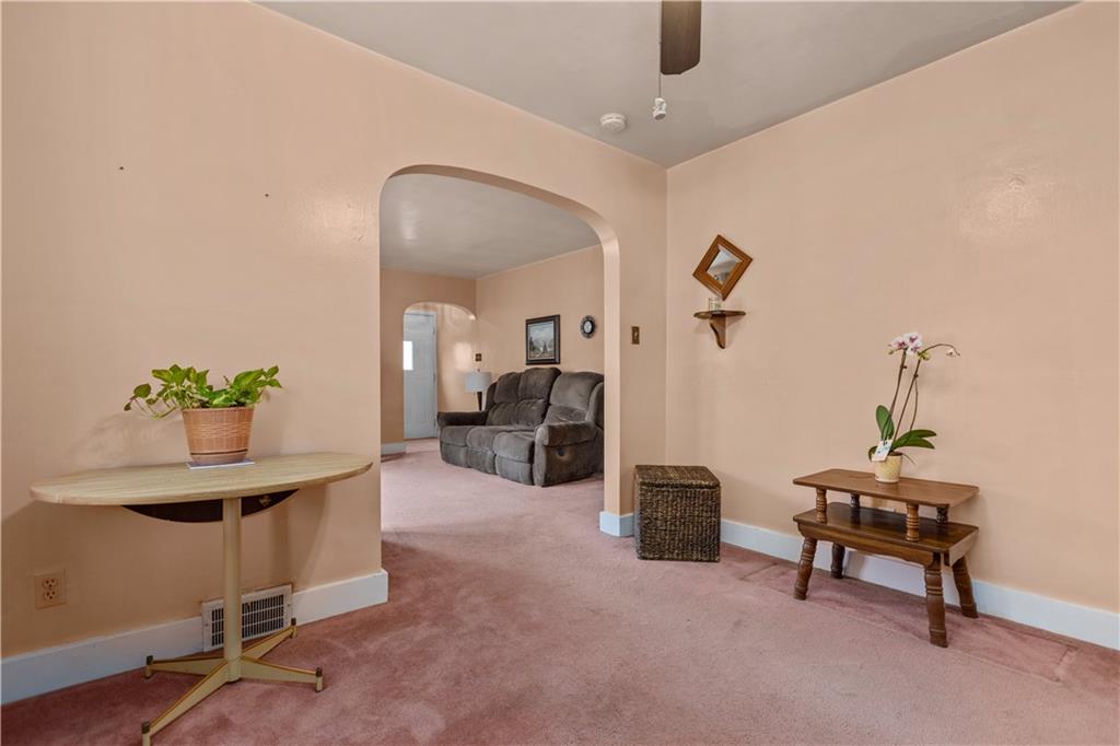 10204 Pearl Road Pittsburgh, PA 15235 - Photo 6 of 32 a living room with furniture and a potted plant