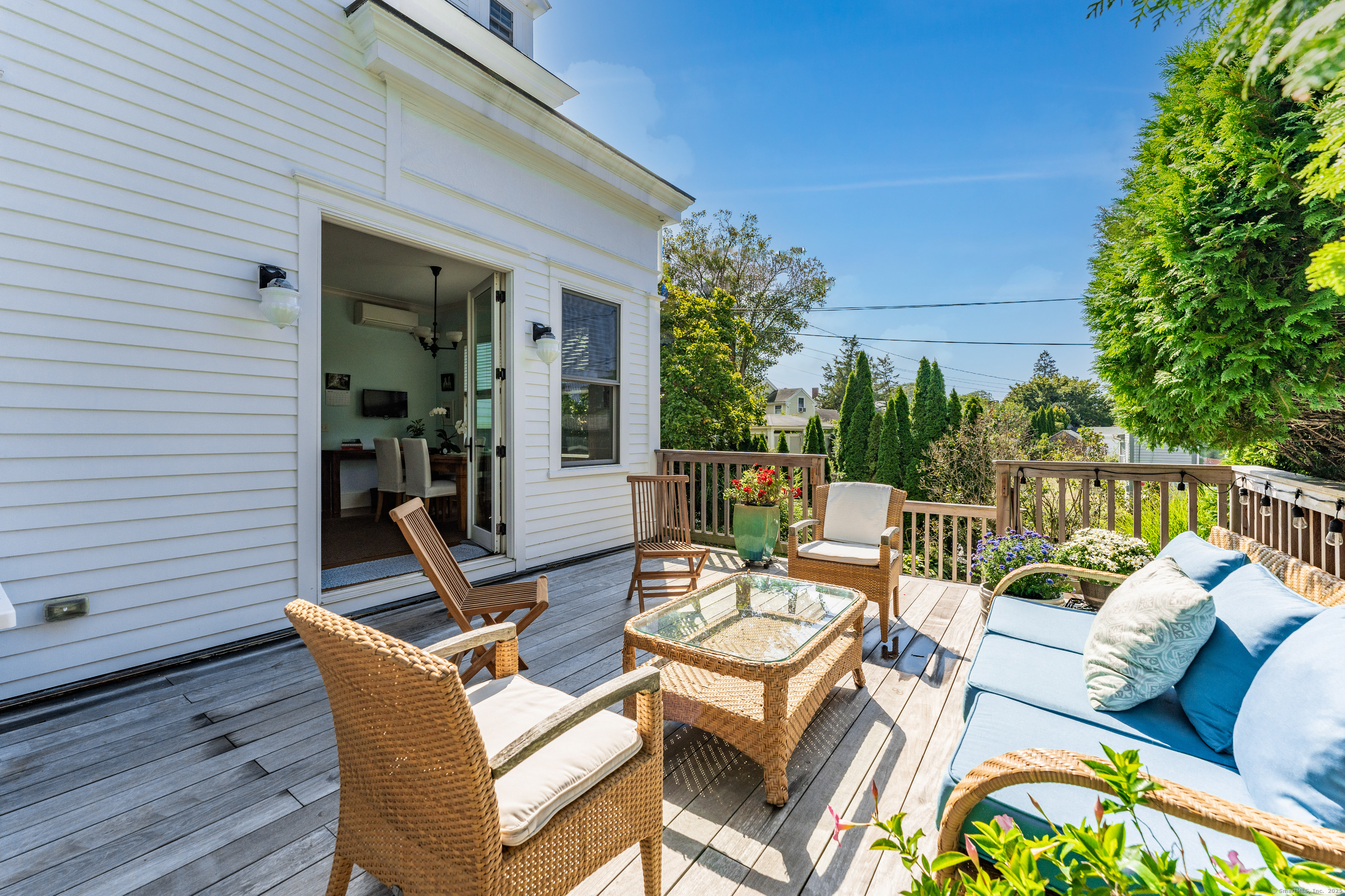 27 Church Street Groton, CT 06340 - Photo 15 of 37 a view of a patio with a dining table and chairs with wooden floor