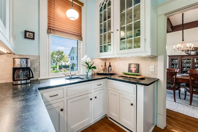a kitchen with stainless steel appliances granite countertop a stove and a sink