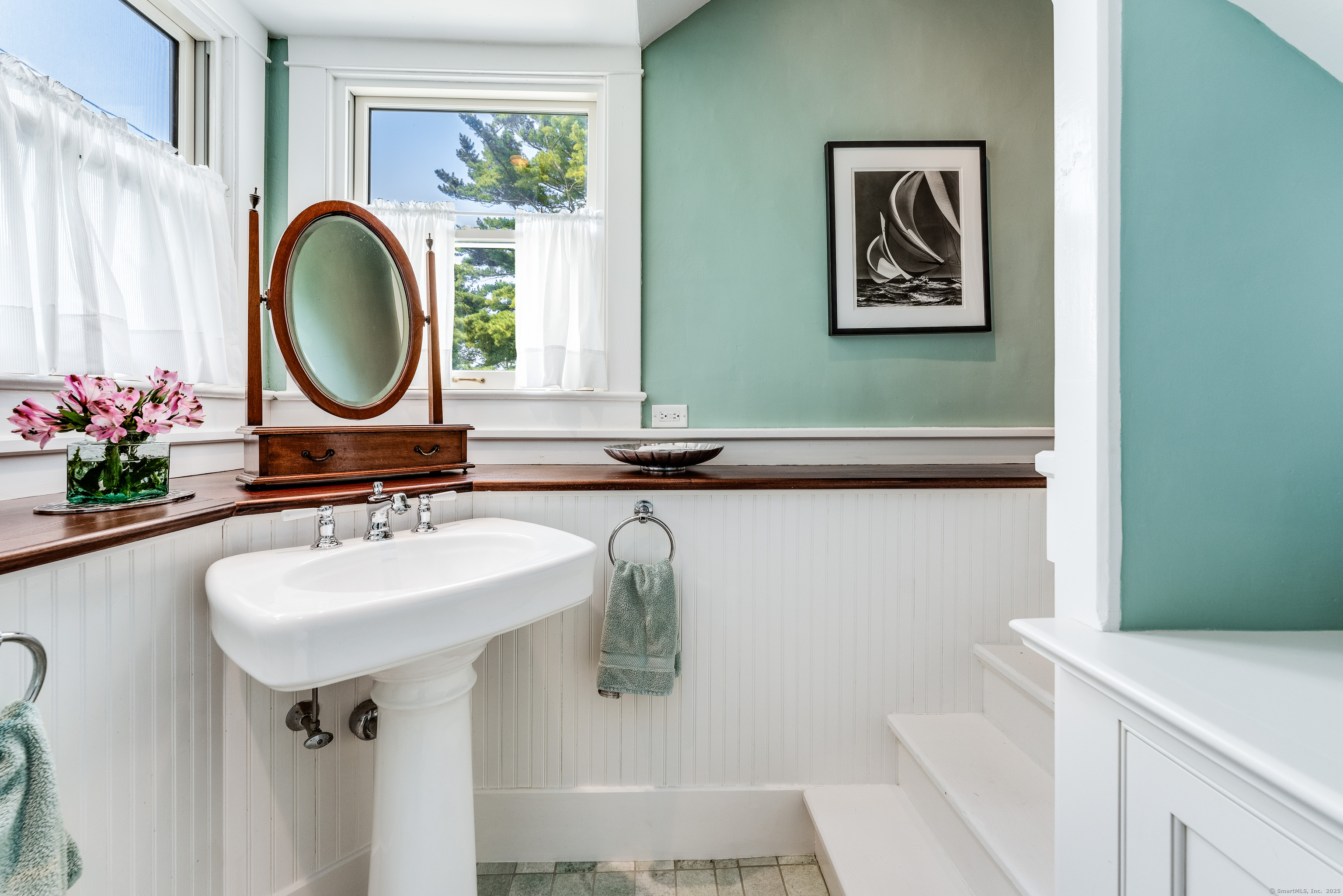 27 Church Street Groton, CT 06340 - Photo 18 of 37 a bathroom with a sink and a mirror