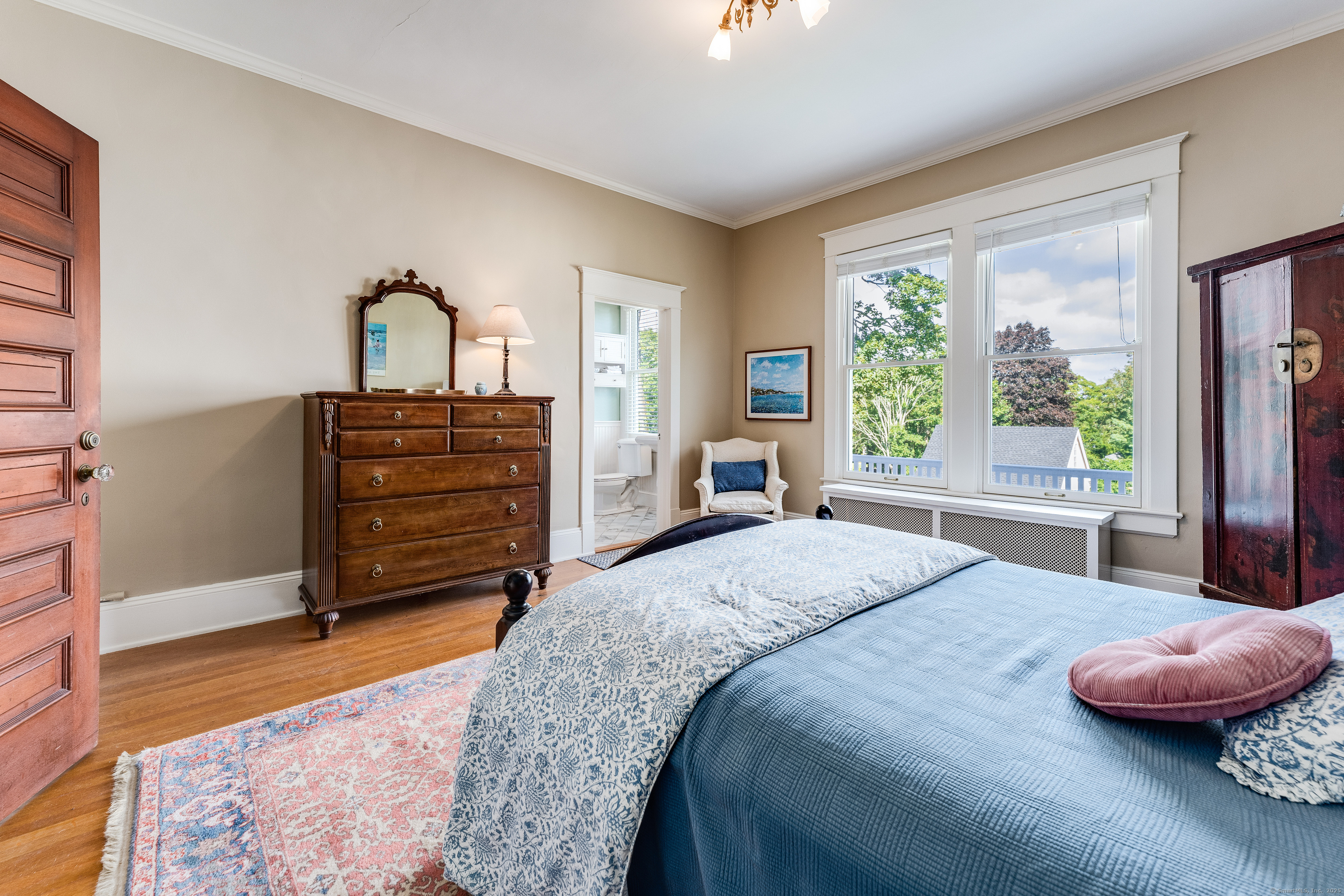 27 Church Street Groton, CT 06340 - Photo 21 of 37 a bedroom with a bed and large windows